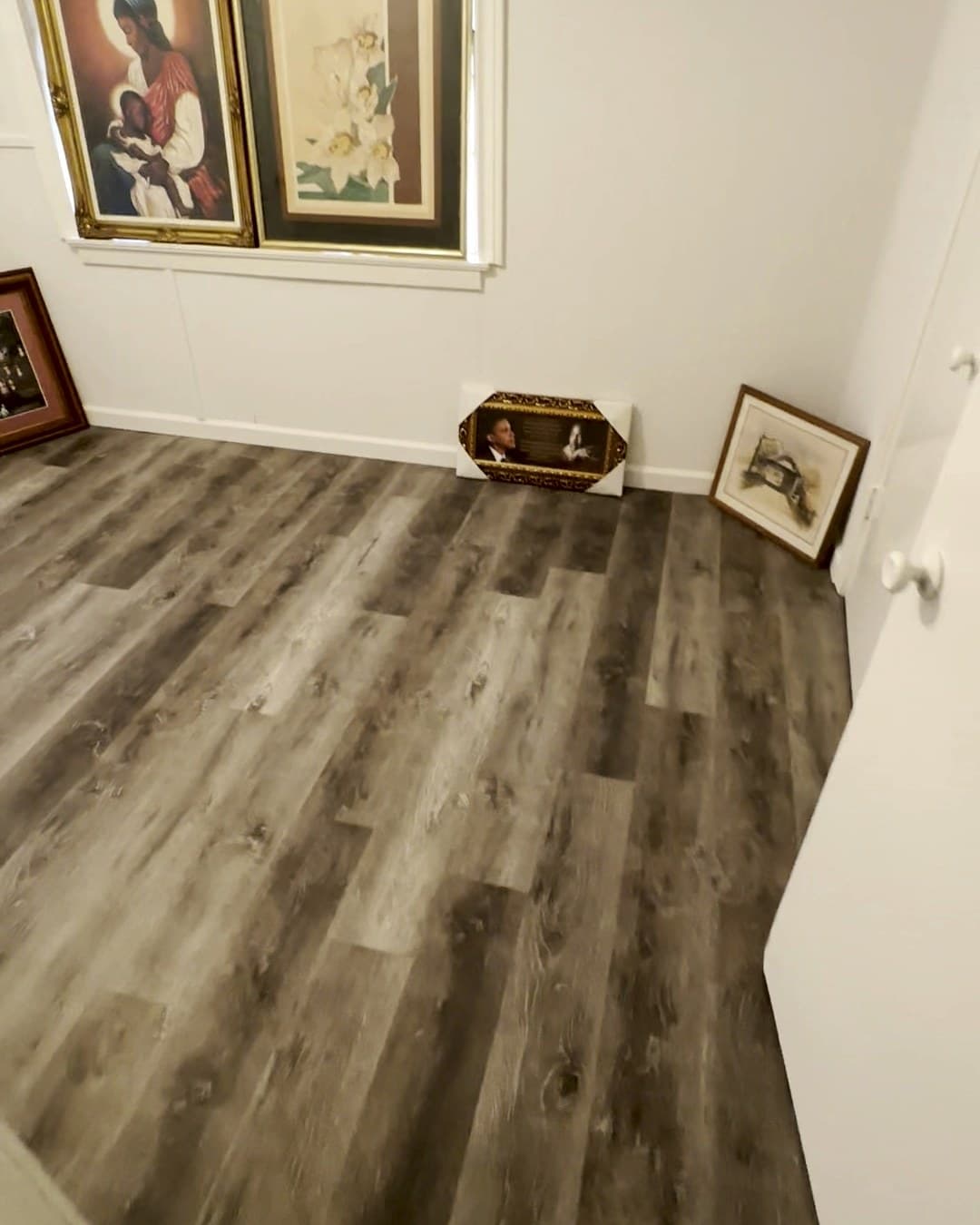 Interior room, with framed pictures set aside.