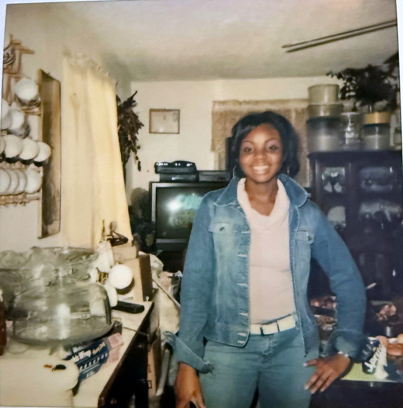 Young Josie Smith smiling in the kitchen of her grandparents’ Sunnyside home during a family gathering.